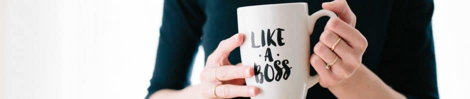 woman holding mug that says like a boss