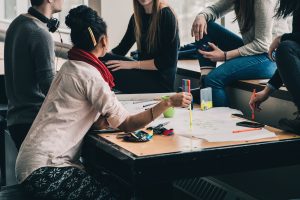 A group of friends, student or colleagues working together, declutter, no clutter